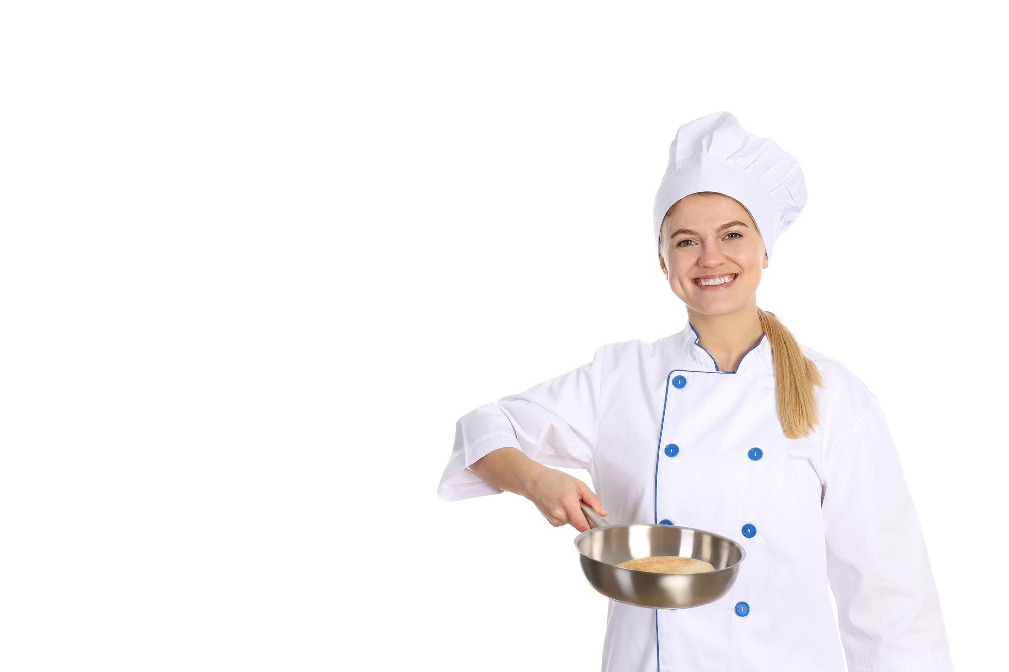 Instructor smiling while teaching a cooking technique