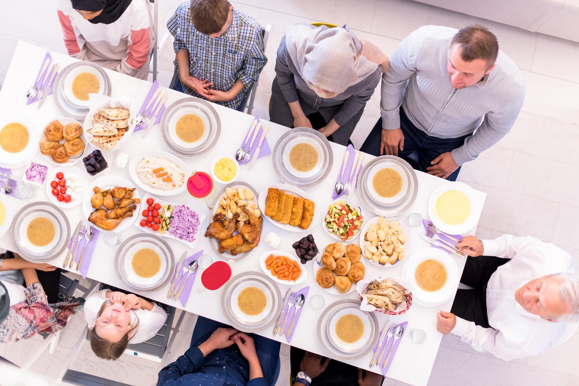 Group tasting dishes seated at a table